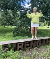 Mo standing on the word strength.